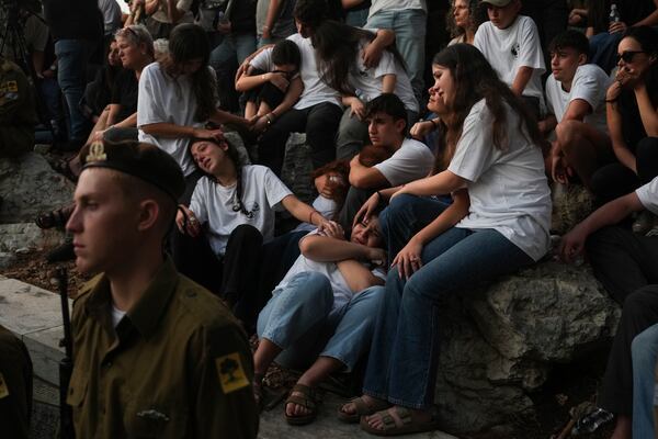 Mourners react during eulogies for Israeli soldier Capt. Itay Marcovich, who was killed in action in Lebanon, during his funeral in Kokhav Yair, Israel, Thursday, Nov. 14, 2024. (AP Photo/Ohad Zwigenberg)