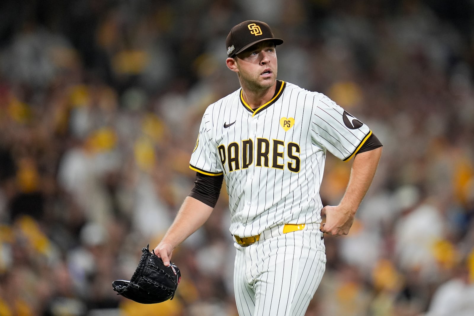 San Diego Padres starting pitcher Michael King walks off the mound after getting the third out during the sixth inning in Game 1 of an NL Wild Card Series baseball game against the Atlanta Braves, Tuesday, Oct. 1, 2024, in San Diego. (AP Photo/Gregory Bull)