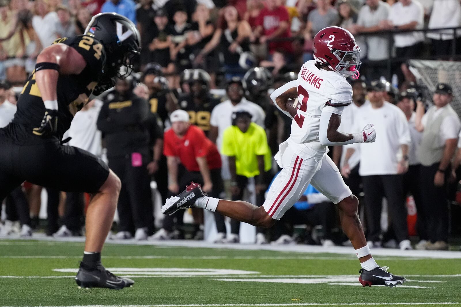 Alabama wide receiver Ryan Williams (2) runs into the end zone for a touchdown past Vanderbilt linebacker Nicholas Rinaldi (24) during the second half of an NCAA college football game Saturday, Oct. 5, 2024, in Nashville, Tenn. (AP Photo/George Walker IV)