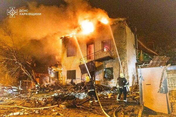 In this photo provided by the Ukrainian Emergency Service, emergency services personnel work to extinguish a fire following a Russian attack in Kharkiv, Ukraine, Wednesday, April 30, 2025. (Ukrainian Emergency Service via AP)