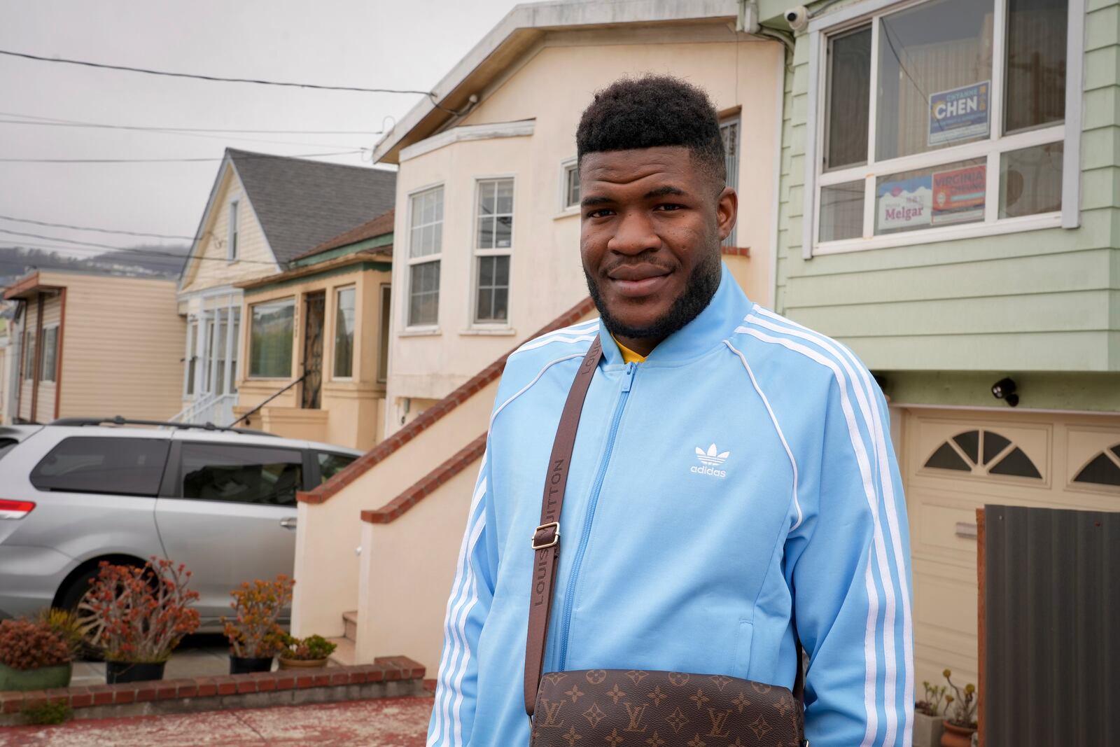 Cabrel Ngougou, a refugee from Cameroon, poses for a photo in San Francisco Tuesday, Sept. 17, 2024. (AP Photo/Terry Chea)