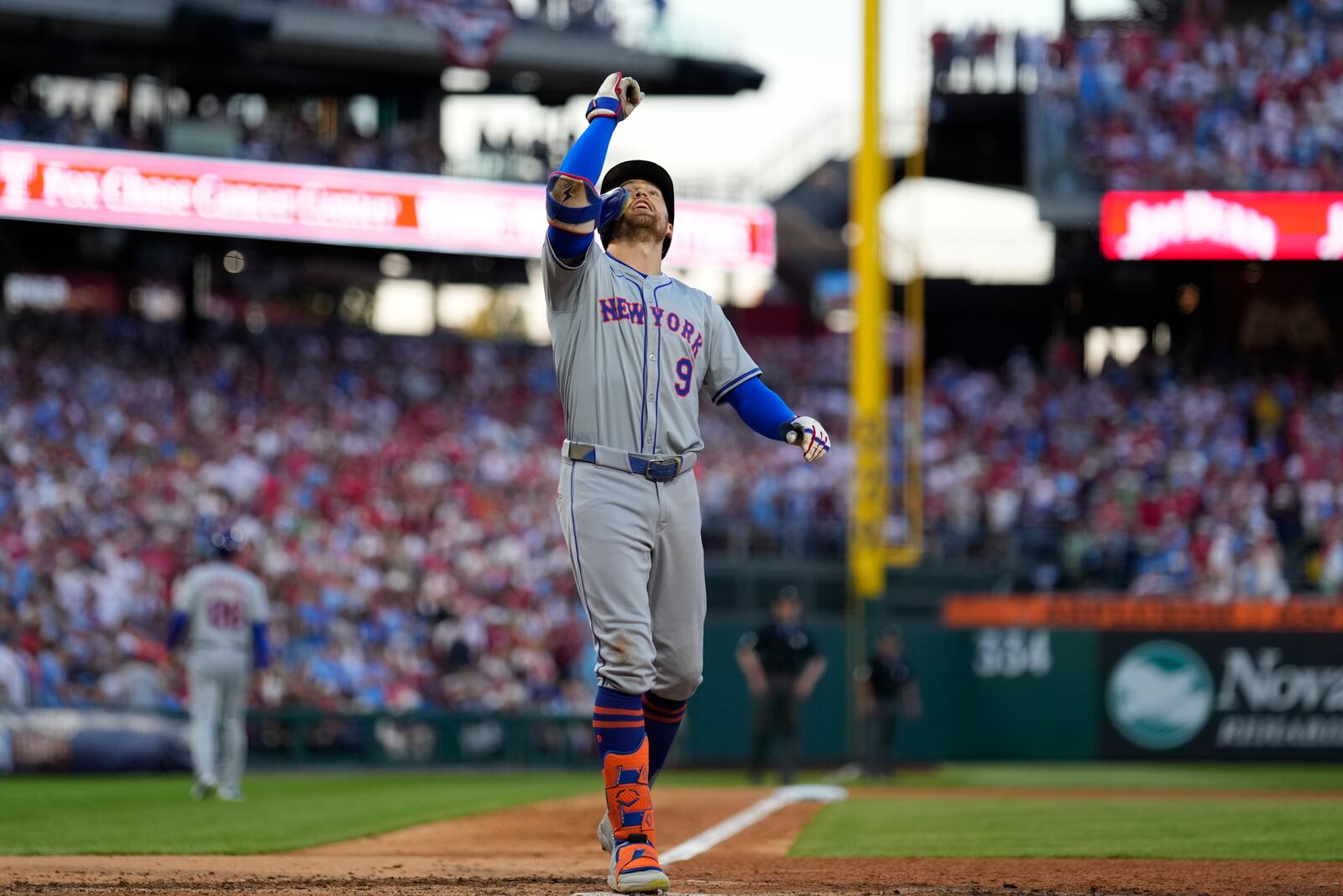 New York Mets' Brandon Nimmo reacts after hitting a home run against Philadelphia Phillies pitcher Orion Kerkering during the seventh inning of Game 2 of a baseball NL Division Series, Sunday, Oct. 6, 2024, in Philadelphia. (AP Photo/Matt Slocum)