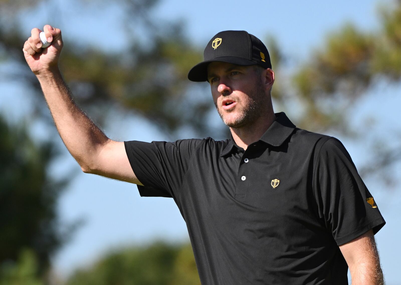 International team member Taylor Pendrith, of Canada, reacts after winning the eighth hole during a fifth-round singles match at the Presidents Cup golf tournament at Royal Montreal Golf Club, Sunday, Sept. 29, 2024,in Montreal. (Graham Hughes/The Canadian Press via AP)