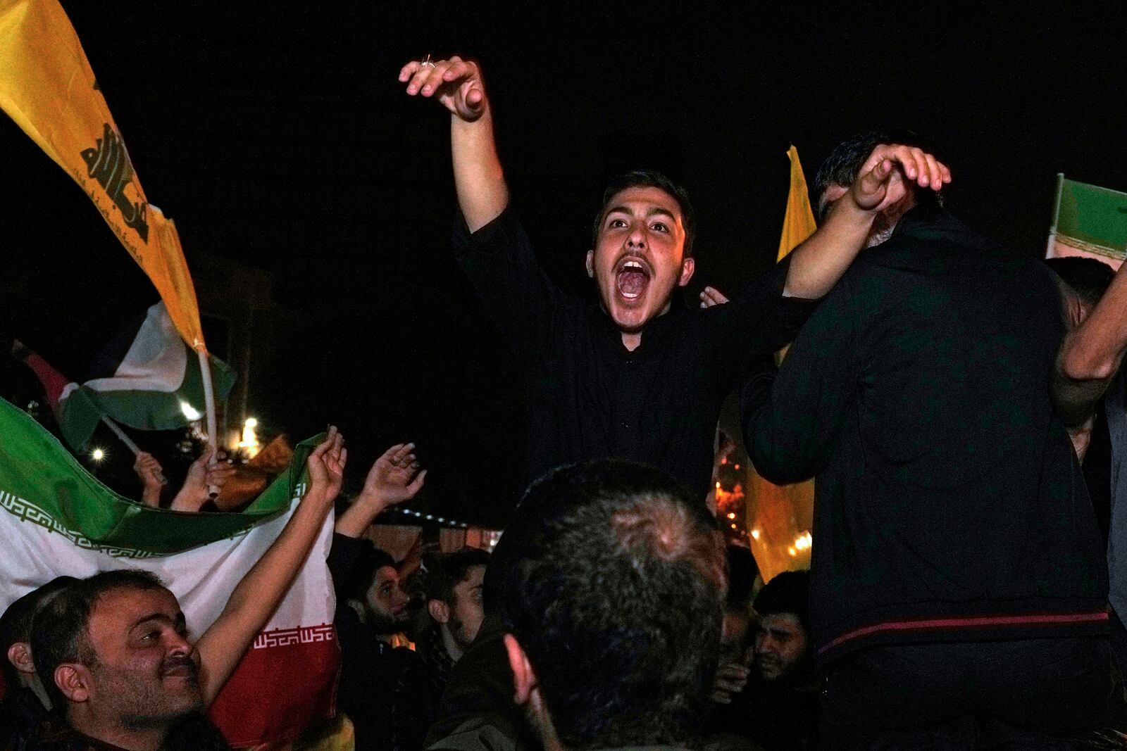 Demonstrators celebrate Iran's missile strike against Israel during a gathering in front of the British Embassy in Tehran, Iran, Tuesday, Oct. 1, 2024. (AP Photo/Vahid Salemi)