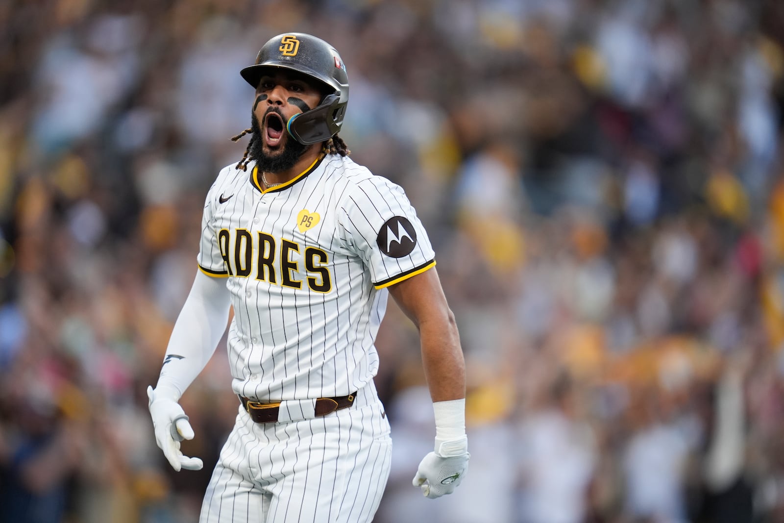 San Diego Padres' Fernando Tatis Jr. celebrates after hitting a two-run home run during the first inning in Game 1 of an NL Wild Card Series baseball game against the Atlanta Braves, Tuesday, Oct. 1, 2024, in San Diego. (AP Photo/Gregory Bull)