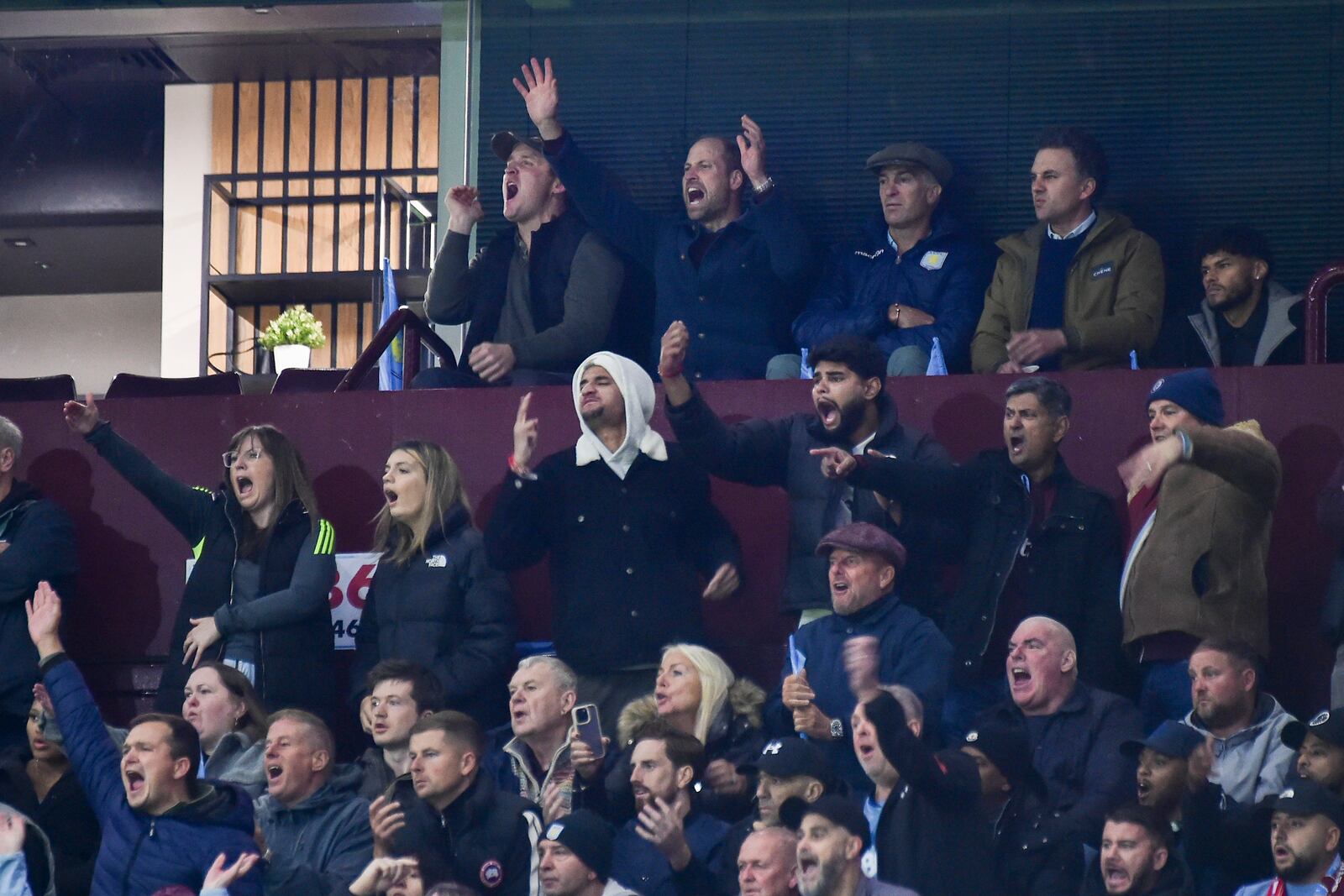 Britain's Prince William, second left in back row, reacts during the Champions League opening phase soccer match between Aston Villa and Bayern Munich, at Villa Park in Birmingham, England, Wednesday, Oct. 2, 2024. (AP Photo/Rui Vieira)