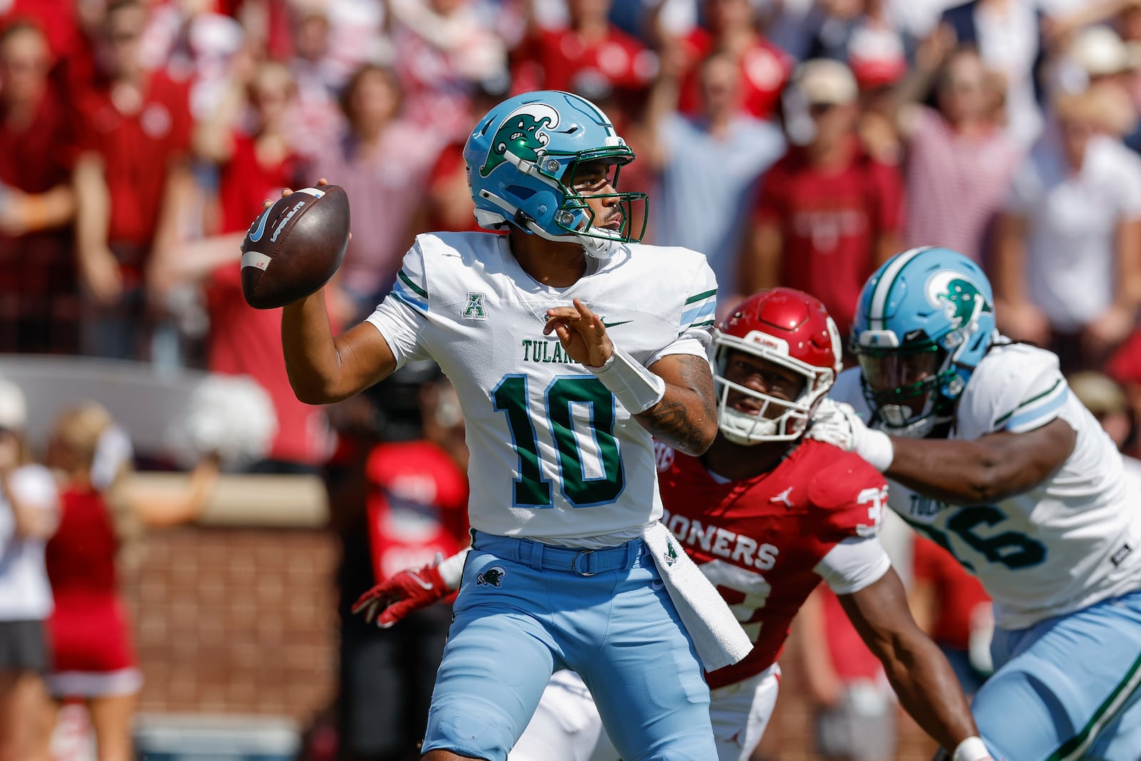 Tulane quarterback Darian Mensah (10) passes against Oklahoma during the first quarter of an NCAA college football game Saturday, Sept. 14, 2024, in Norman, Okla. (AP Photo/Alonzo Adams)