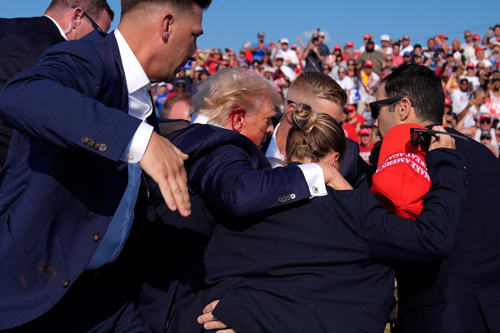 FILE - Republican presidential candidate former President Donald Trump is surrounded by U.S. Secret Service agents at a campaign rally, July 13, 2024, in Butler, Pa. (AP Photo/Evan Vucci, File)