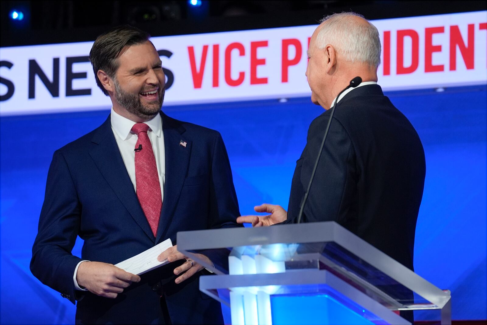 Republican vice presidential nominee Sen. JD Vance, R-Ohio, talks with Democratic vice presidential candidate Minnesota Gov. Tim Walz after the vice presidential debate hosted by CBS News Tuesday, Oct. 1, 2024, in New York. (AP Photo/Matt Rourke)