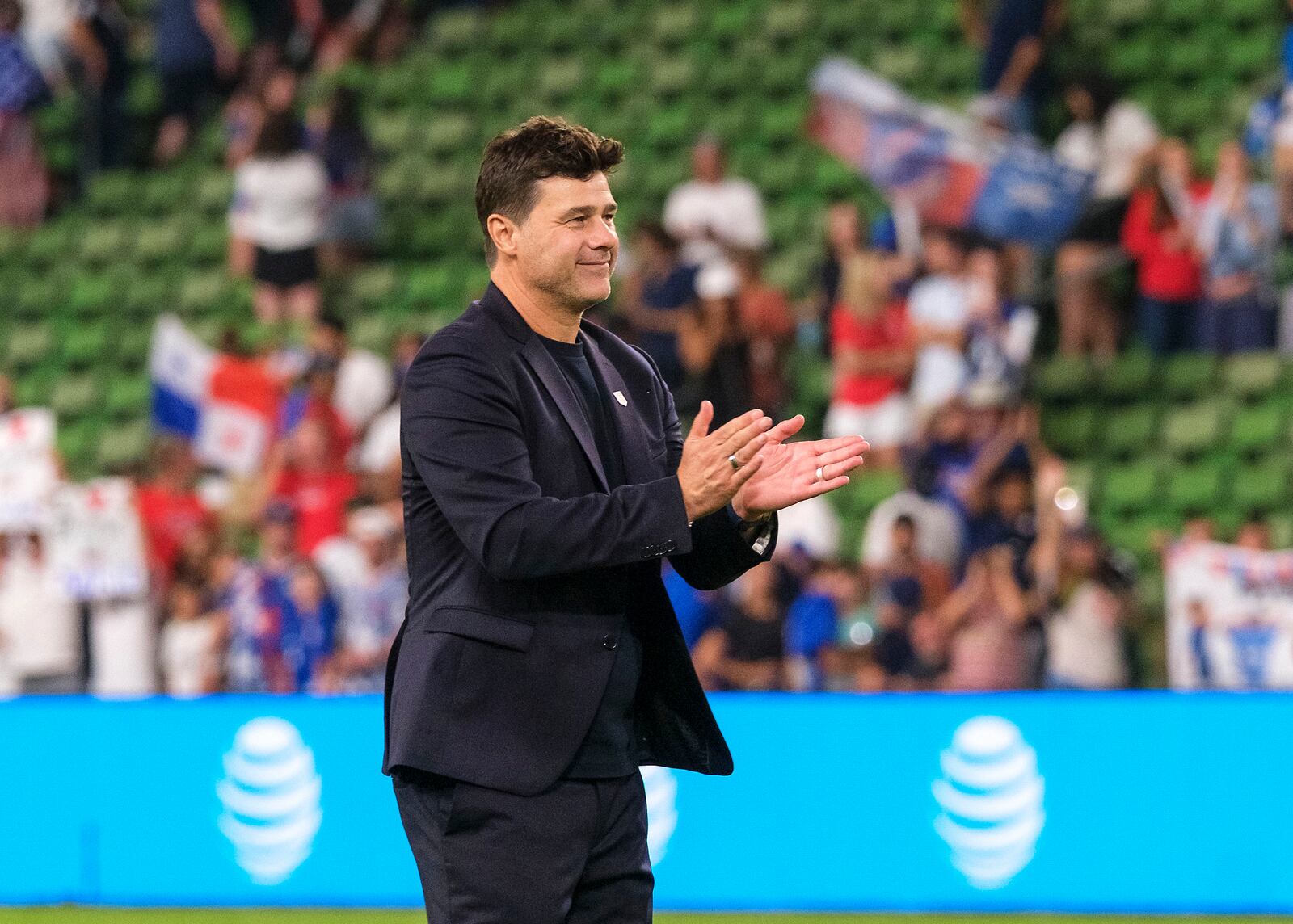 United States head coach Mauricio Pochettino celebrates with fans after defeating Panama in an international friendly soccer match, Saturday, Oct. 12, 2024, in Austin, Texas. (AP Photo/Rodolfo Gonzalez)