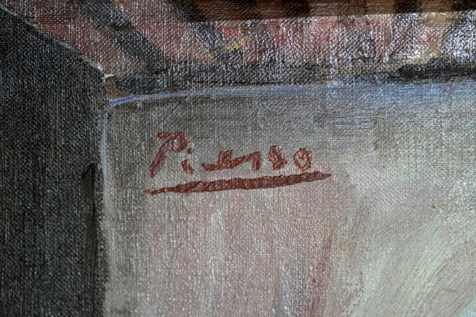 A painting is seen at a restoration laboratory in Milan, Italy, Thursday, Oct. 3, 2024. An Italian family hopes to prove definitively that a painting discarded from a villa on Capri more than 60 years ago is a Picasso. (AP Photo/Antonio Calanni)