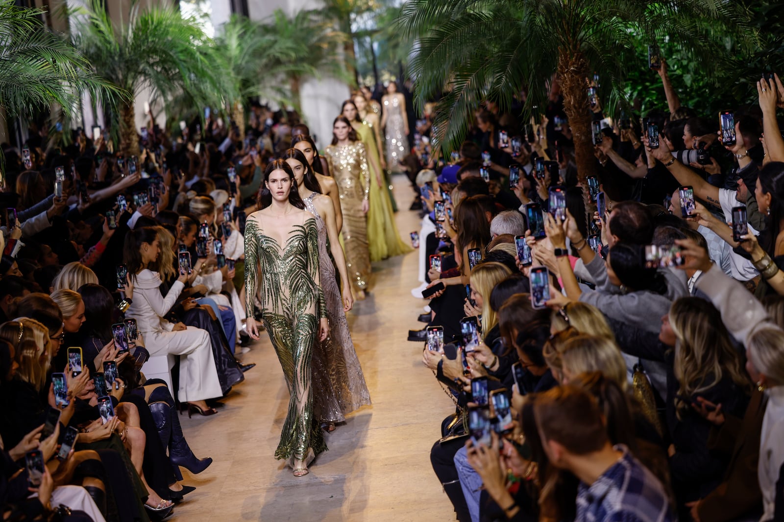 Models wear creations as part of the Elie Saab Spring/Summer 2025 collection presented Saturday, Sept. 28, 2024, in Paris. (Photo by Vianney Le Caer/Invision/AP)