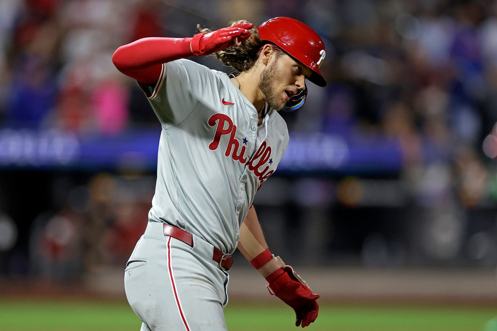 Philadelphia Phillies' Alec Bohm reacts after hitting a three-run home run during the fourth inning of a baseball game against the New York Mets Friday, Sept. 20, 2024, in New York. (AP Photo/Adam Hunger)