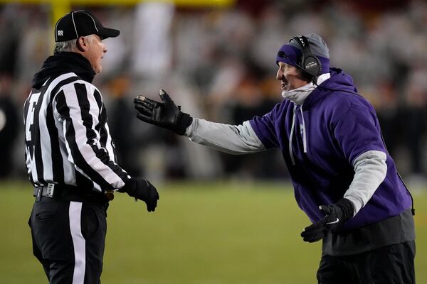 Kansas State head coach Chris Klieman, right, questions a call during the first half of an NCAA college football game against Iowa State, Saturday, Nov. 30, 2024, in Ames, Iowa. (AP Photo/Charlie Neibergall)