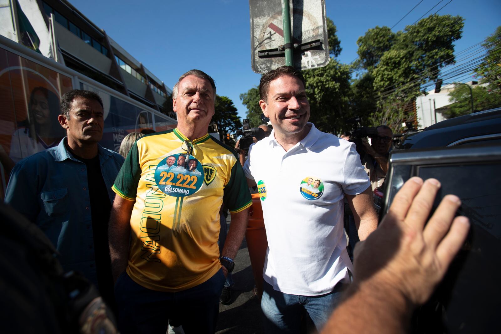 Former President Jair Bolsonaro, center, campaigns with Rio de Janeiro mayoral candidate Alexandre Ramagem, right, of the Liberal Party after voting in the municipal elections, in Rio de Janeiro, Sunday, Oct. 6, 2024. (AP Photo/Bruna Prado)