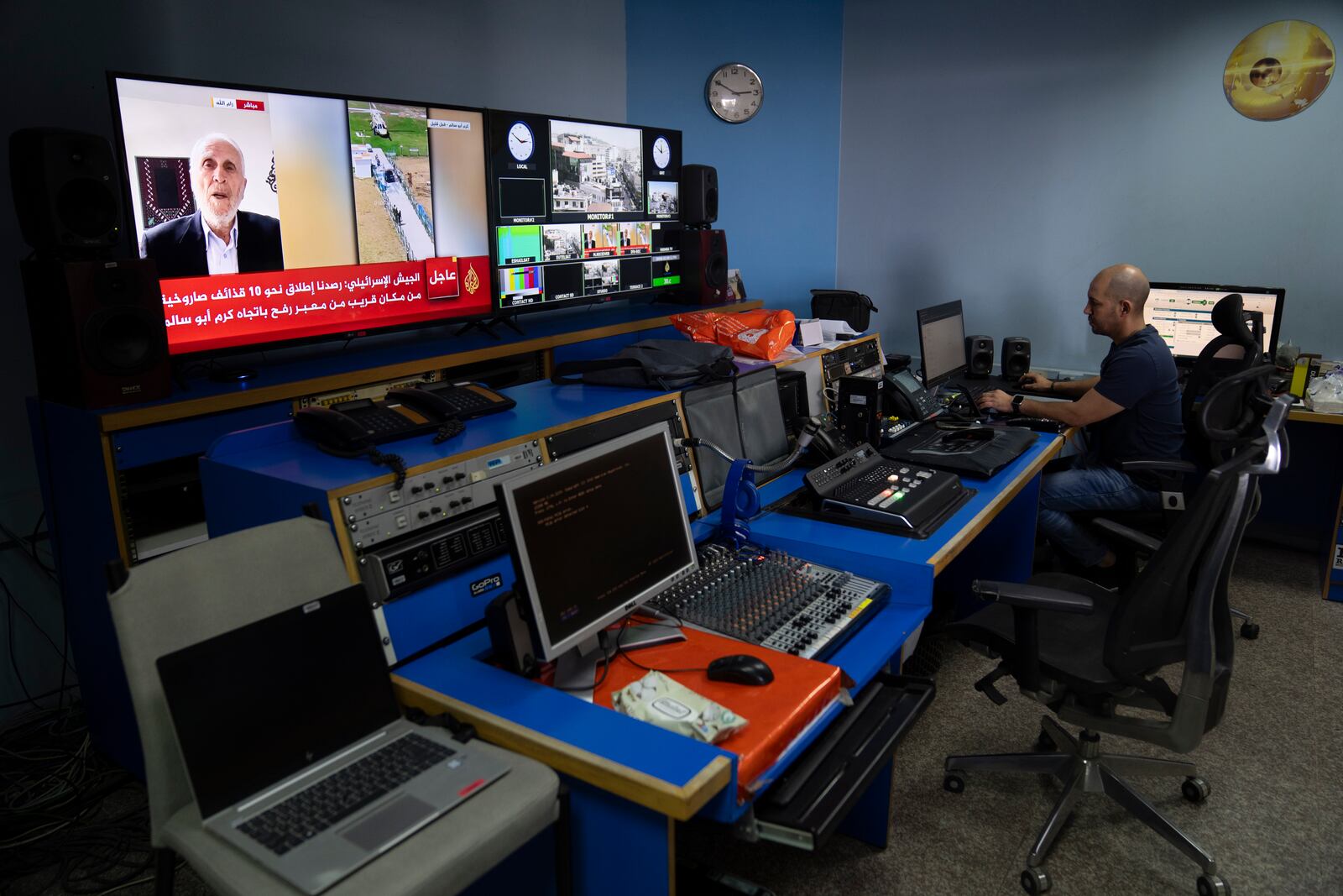 FILE - Al Jazeera broadcast engineer Mohammad Salameh works at the Master Control Room unit inside the network's office in the West Bank city of Ramallah, May 5, 2024. (AP Photo/Nasser Nasser, File)