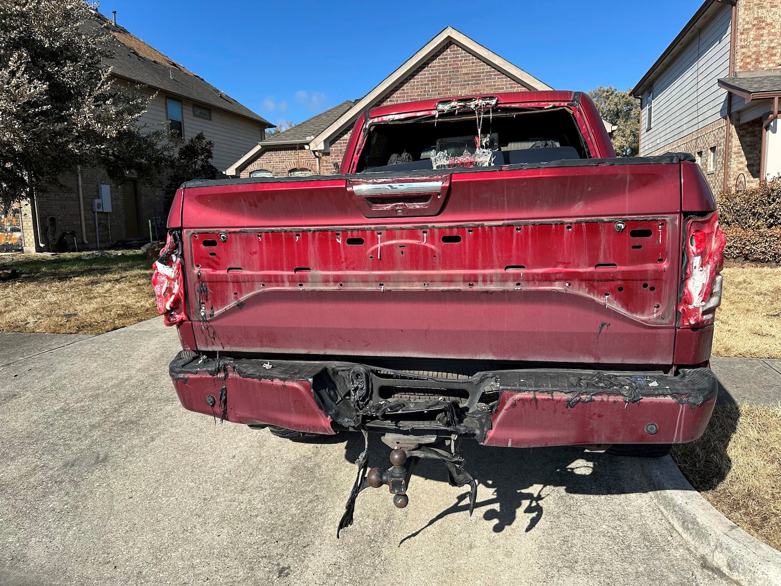 A truck that had parts of its equipment melted by the heat of a pipeline fire sits in the driveway of a home in Deer Park, Texas, on Thursday, Sept. 19, 2024. (AP Photo/Juan A. Lozano)(AP Photo/Juan A. Lozano)