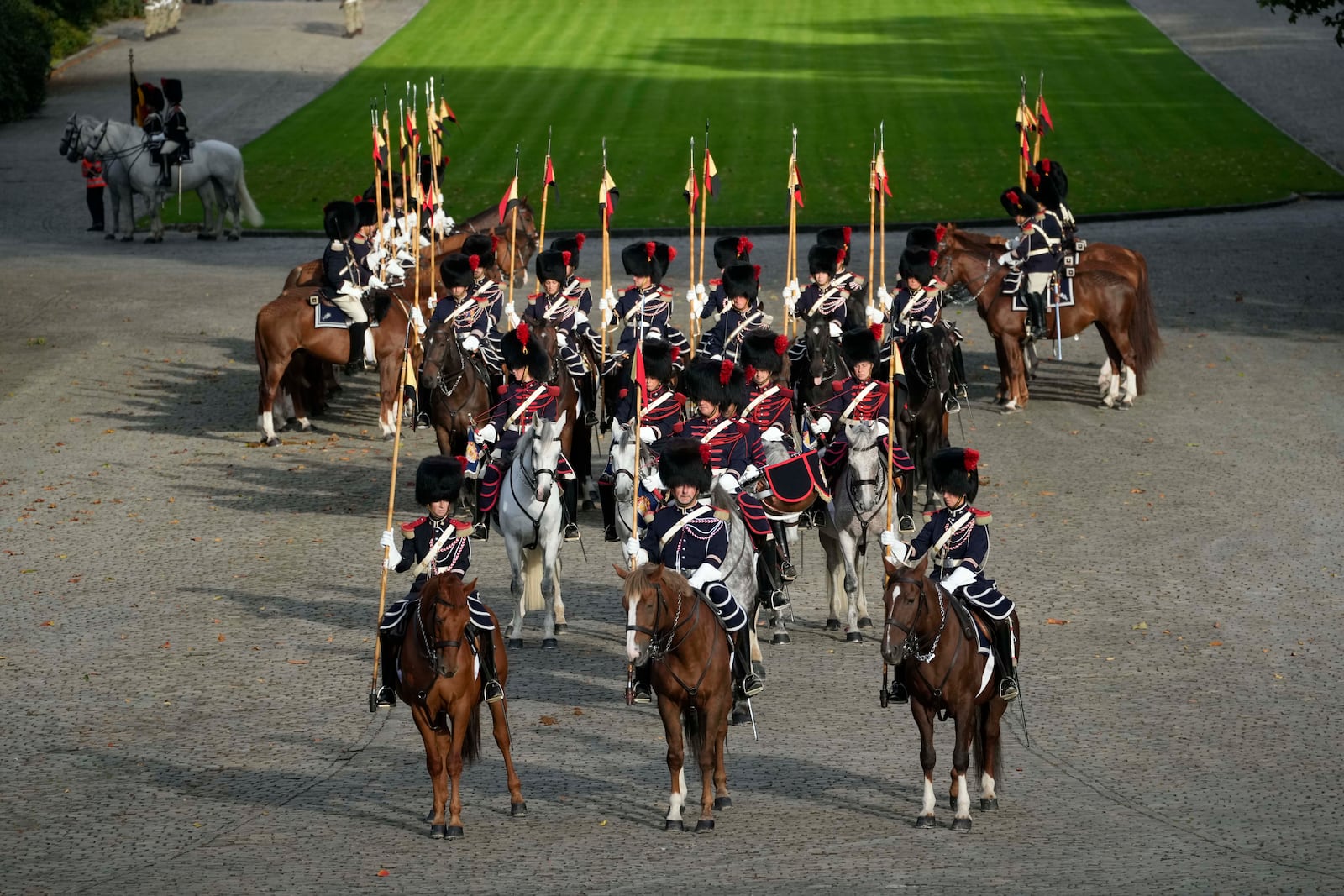 Belgian Royal Escort wait for the arrival of Pope Francis on the occasion of his visit to King Philippe and Queen Mathilde in the Castle of Laeken, Brussels, Friday, Sept. 27, 2024. (AP Photo/Andrew Medichini)