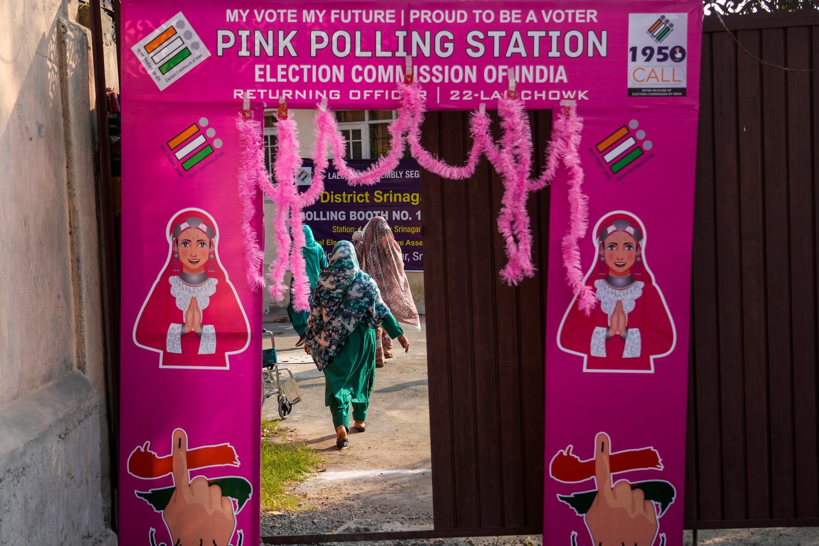 Voters walk inside the polling station to cast their votes during the second phase of the assembly election in Srinagar, Indian controlled Kashmir, Wednesday, Sept. 25, 2024.(AP Photo/Mukhtar Khan)