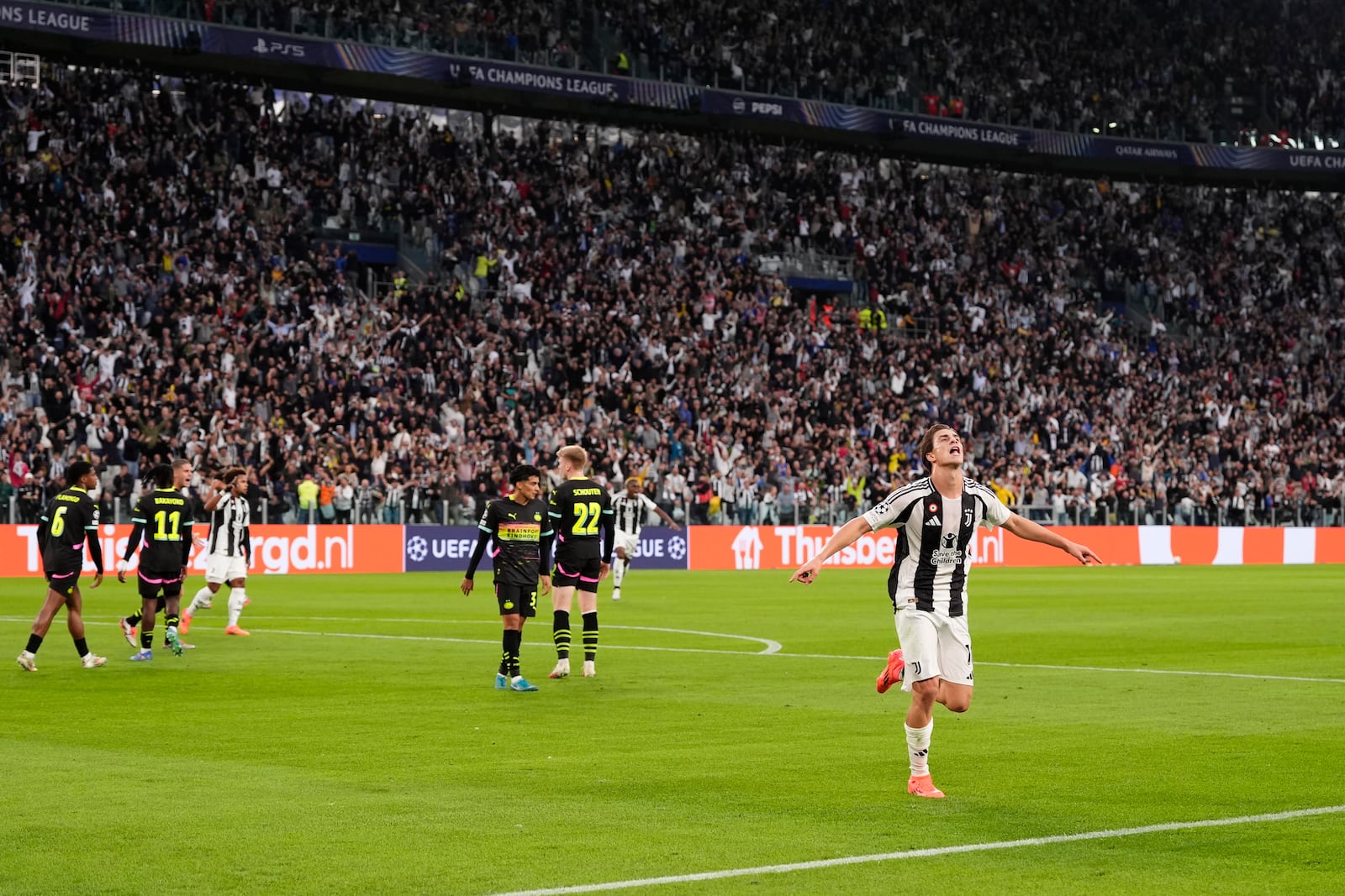 Juventus' Kenan Yildiz celebrates after scoring the opening goal during the Champions League opening phase soccer match between Juventus and PSV Eindhoven at the Juventus stadium in Turin, Italy, Tuesday, Sept. 17, 2024. (Fabio Ferrari/LaPresse via AP)