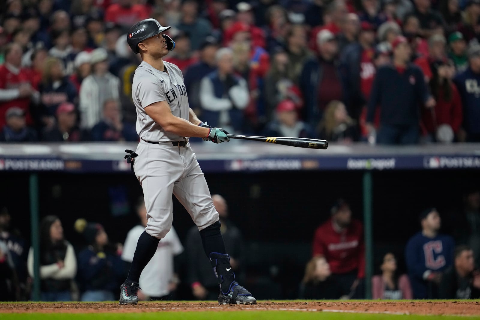 New York Yankees' Giancarlo Stanton watches his two-run home run against the Cleveland Guardians during the sixth inning in Game 5 of the baseball AL Championship Series Saturday, Oct. 19, 2024, in Cleveland. (AP Photo/Godofredo A. Vásquez)