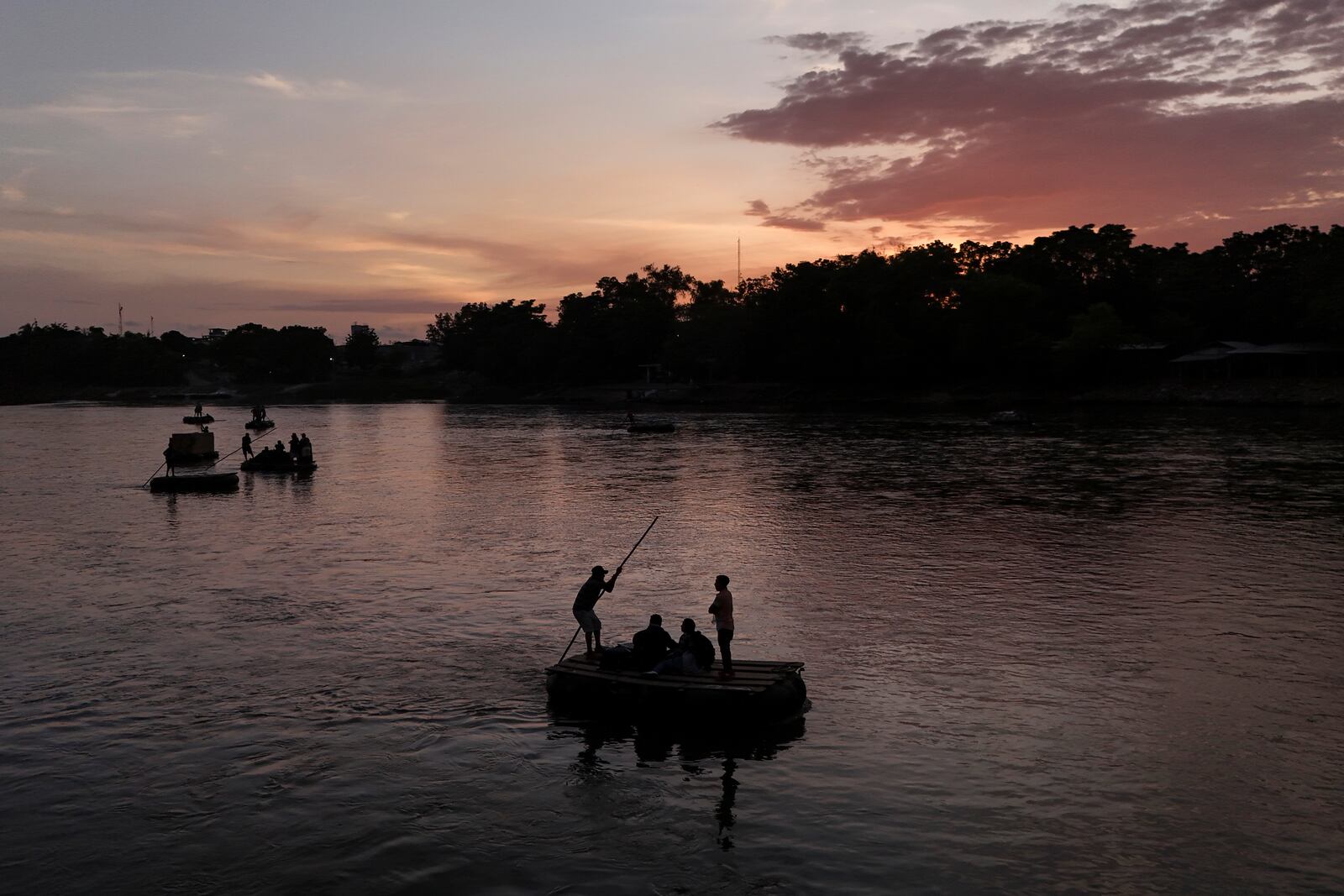 Salvadoran migrant Maria Garcia and her boyfriend cross the Suchiate River, which marks the border between Guatemala and Mexico, from Tecun Uman, Guatemala, Monday, Oct. 28, 2024. (AP Photo/Matias Delacroix)