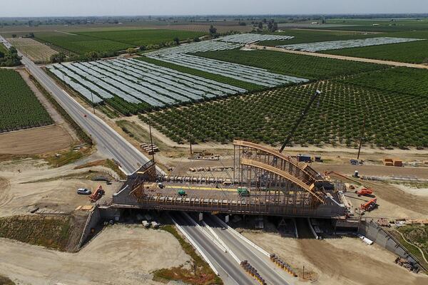 The Tied Arch Bridge construction site, which will take high-speed trains over State Route 43, is shown in an aerial view, Tuesday, April 15, 2025, in Fresno County, Calif. (AP Photo/Godofredo A. Vásquez)