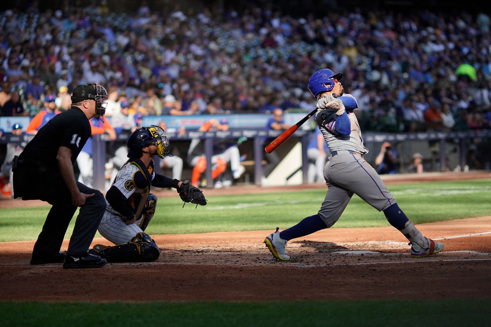 New York Mets' Francisco Lindor hits a solo home run during the sixth inning of a baseball game against the Milwaukee Brewers, Sunday, Sept. 29, 2024, in Milwaukee. (AP Photo/Aaron Gash)