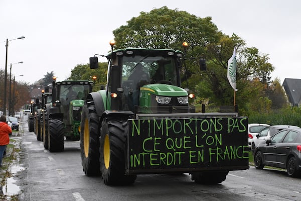 Farmers drive their tractors before a rally against the EU-Mercosur trade agreement, Monday, Nov. 18, 2024 in Beauvais, northern France. Poster reads: do not import what is is forbidden in France. (AP Photo/Matthieu Mirville)