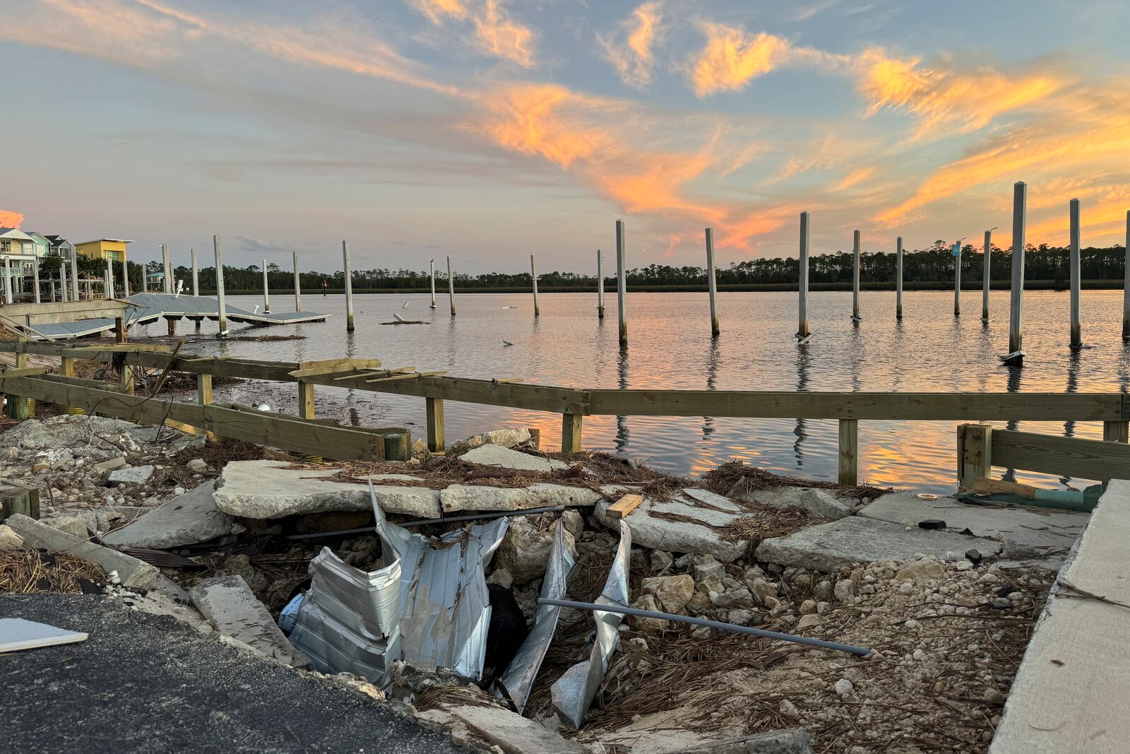 The sun sets over the storm-damaged Steinhatchee marina near where the Steinhatchee River flows into the Gulf of Mexico, Sunday, Sept. 29, 2024, in the aftermath of Hurricane Helen. (AP Photo/Kate Payne) Kate Payne Reporter, State Government Education Tallahassee, FL C 850.545.4283 kpayne@ap.or