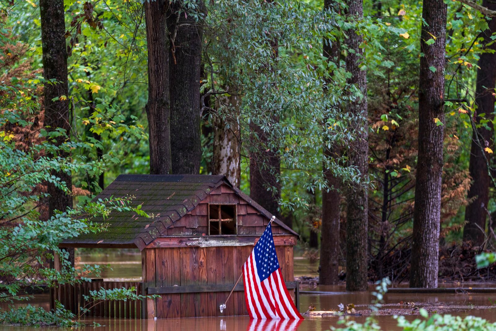 Floodwaters surround a structure Wednesday, Sept 27, 2024, in Atlanta. (AP Photo/Jason Allen)