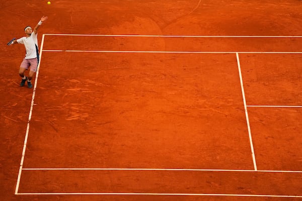 Norway's Casper Ruud serves to Britain's Jack Draper during the Madrid Open tennis final in Madrid, Spain, Sunday, May 4, 2025. (AP Photo/Manu Fernandez)