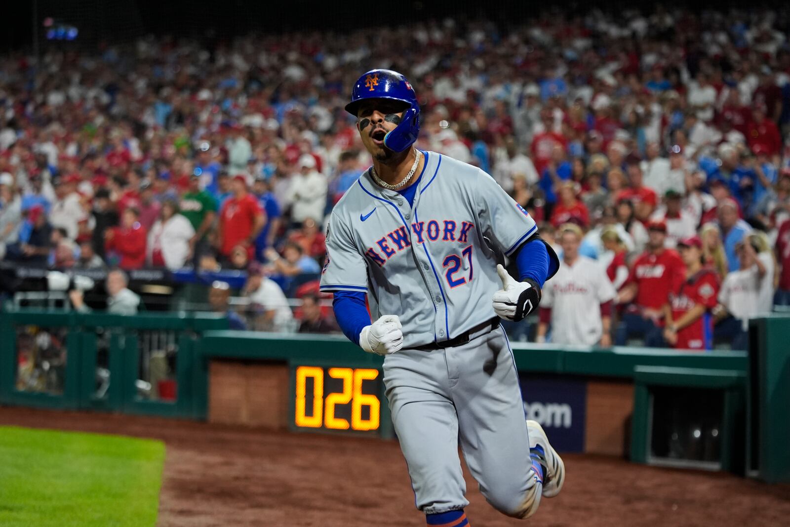 New York Mets' Mark Vientos celebrates hitting a two-run home run against Philadelphia Phillies pitcher Matt Strahm during the ninth inning of Game 2 of a baseball NL Division Series, Sunday, Oct. 6, 2024, in Philadelphia. (AP Photo/Chris Szagola)