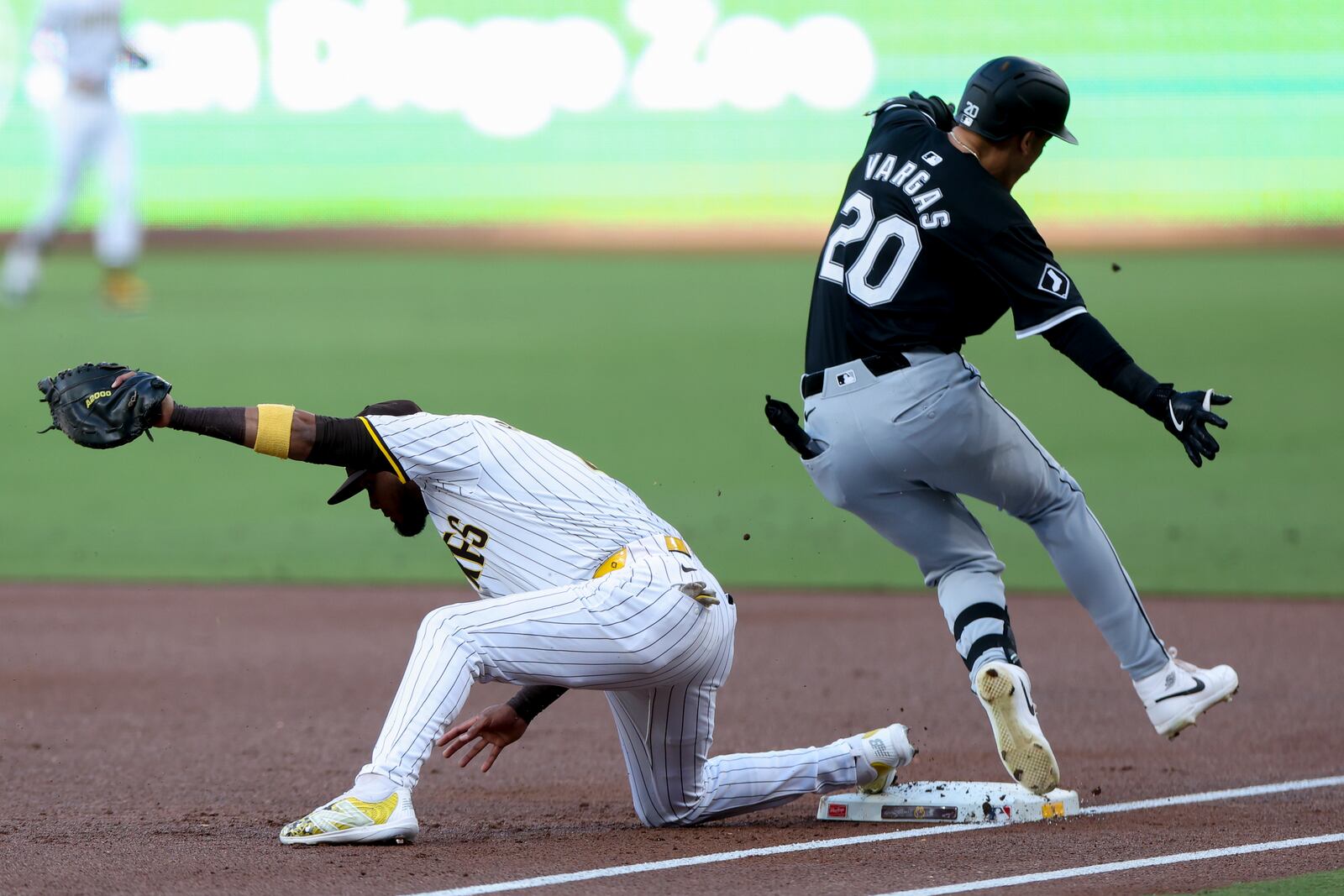 San Diego Padres first baseman Luis Arraez, left, forces out Chicago White Sox's Miguel Vargas during the first inning of a baseball game, Saturday, Sept. 21, 2024, in San Diego. (AP Photo/Ryan Sun)