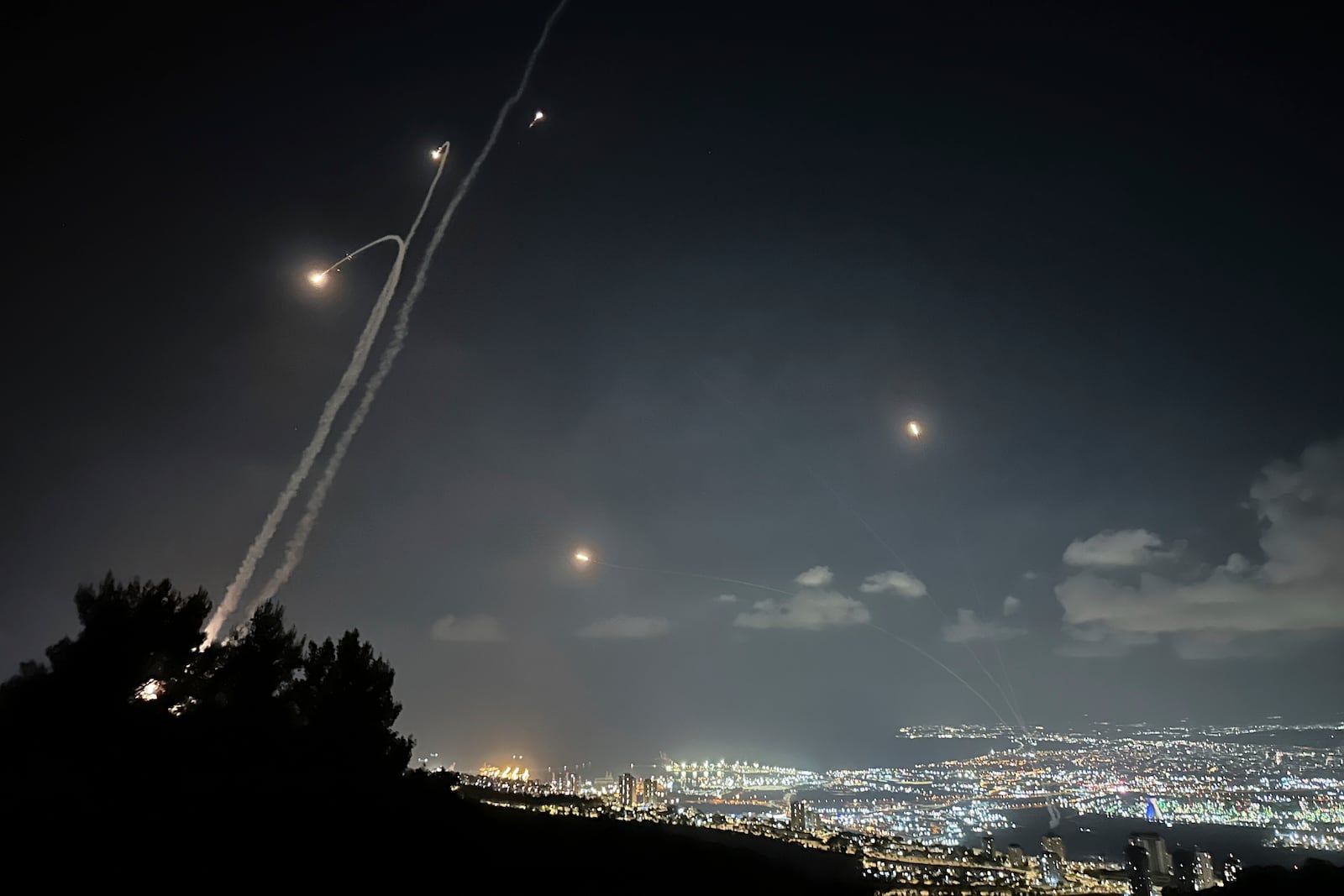 Israeli Iron Dome air defense system fires to intercept rockets that were launched from Lebanon, as seen from Haifa, northern Israel, Monday, Sept. 23, 2024. (AP Photo/Baz Ratner)