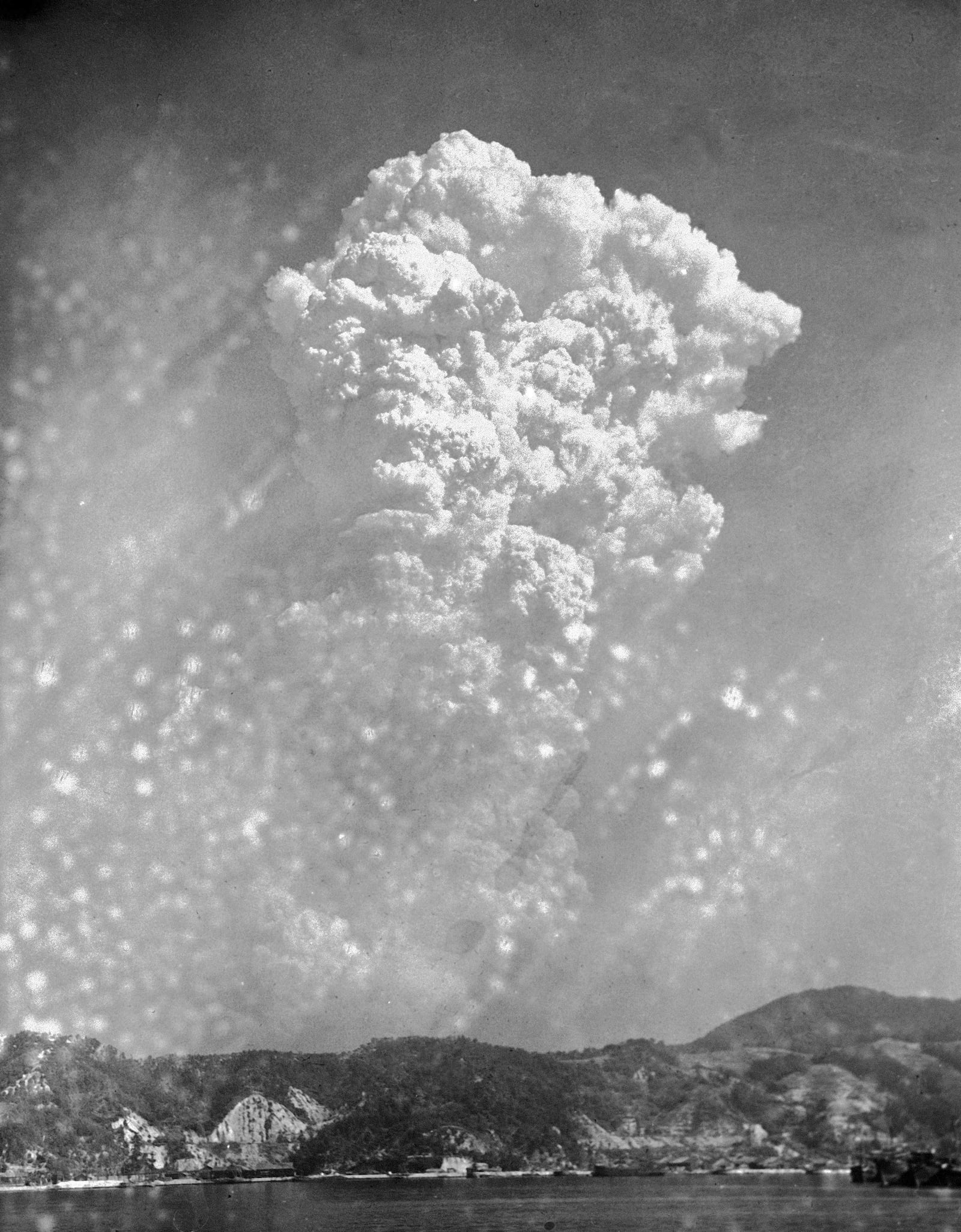 FILE - Smoke rises around 20,000 feet above Hiroshima, Japan, after the first atomic bomb was dropped, Aug. 6, 1945. The Nobel Peace Prize has been awarded to Nihon Hidankyo, a Japanese organization of survivors of the U.S. atomic bombings of Hiroshima and Nagasaki, for its activism against nuclear weapons. (AP Photo, File)