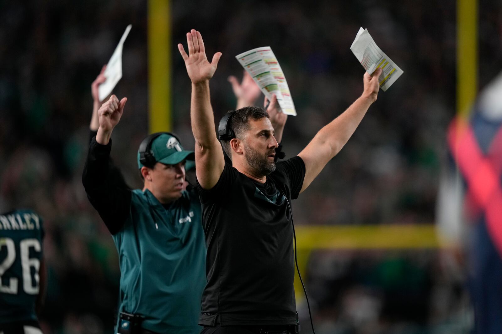 Philadelphia Eagles head coach Nick Sirianni and Kellen Moore, offensive coordinator react to a two-point conversion by Eagles running back Saquon Barkley during the second half of an NFL football game against the Atlanta Falcons on Monday, Sept. 16, 2024, in Philadelphia. (AP Photo/Matt Slocum)