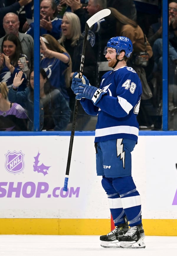 Tampa Bay Lightning defenseman Nick Perbix celebrates his goal during the first period of an NHL hockey game against the Colorado Avalanche Monday, Nov. 25, 2024, in Tampa, Fla. (AP Photo/Jason Behnken)