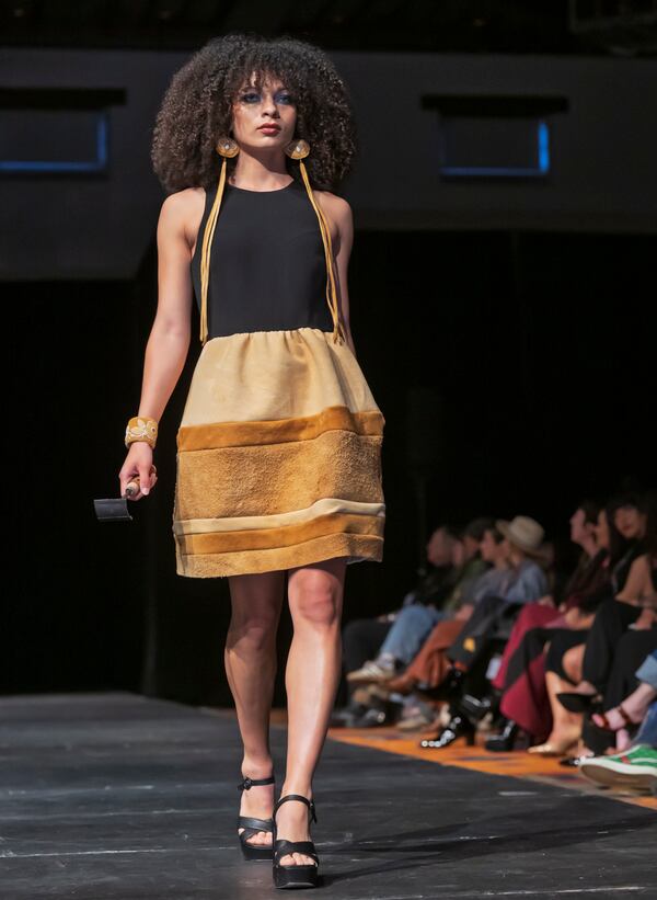 A model wears a design by Randi Nelson on the runway at the 2025 Native Fashion Show, Friday, May 9, 2025, in Santa Fe, N.M. (AP Photo/Roberto E. Rosales)