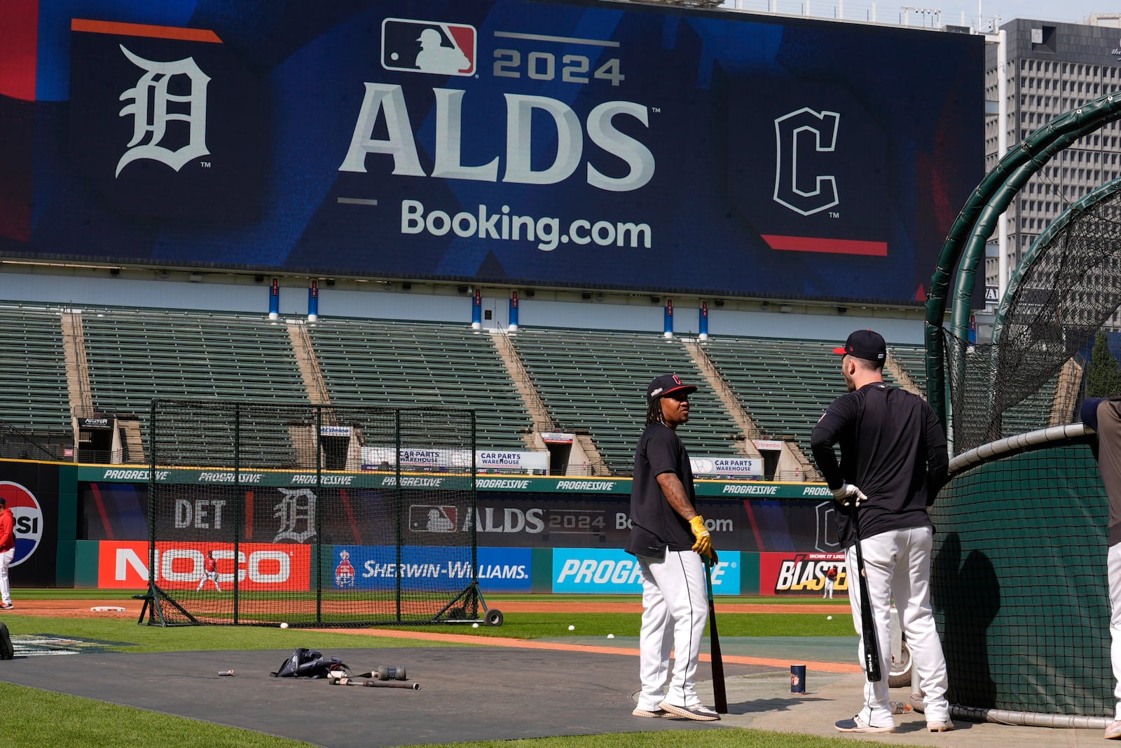 Cleveland Guardians' Jose Ramirez, left, and David Fry, right, talk near the batting cage during a baseball workout in Cleveland, Friday, Oct. 4, 2024, in preparation for the American League Division Series against the Detroit Tigers. (AP Photo/Sue Ogrocki)