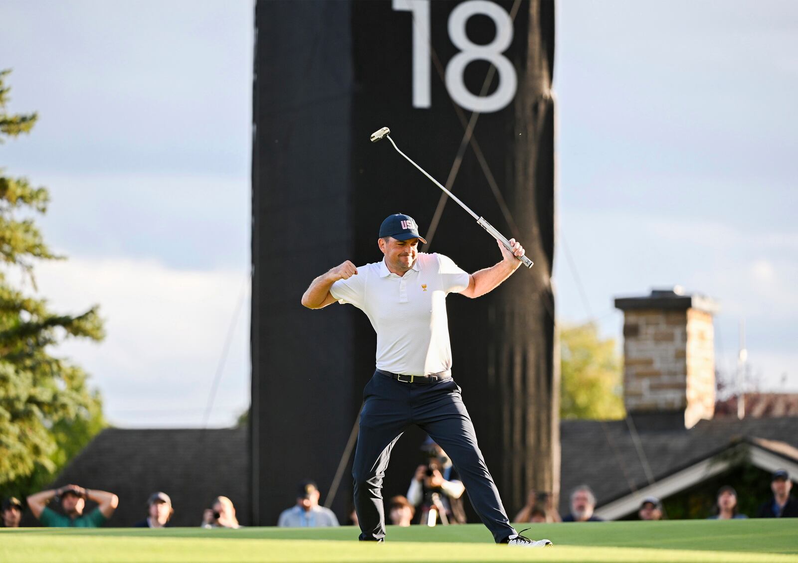 United States team member Keegan Bradley reacts on the 18th green after defeating the international team during a first-round four-ball match at the Presidents Cup golf tournament at the Royal Montreal Golf Club in Montreal, Thursday, Sept. 26, 2024. (Graham Hughes/The Canadian Press via AP)