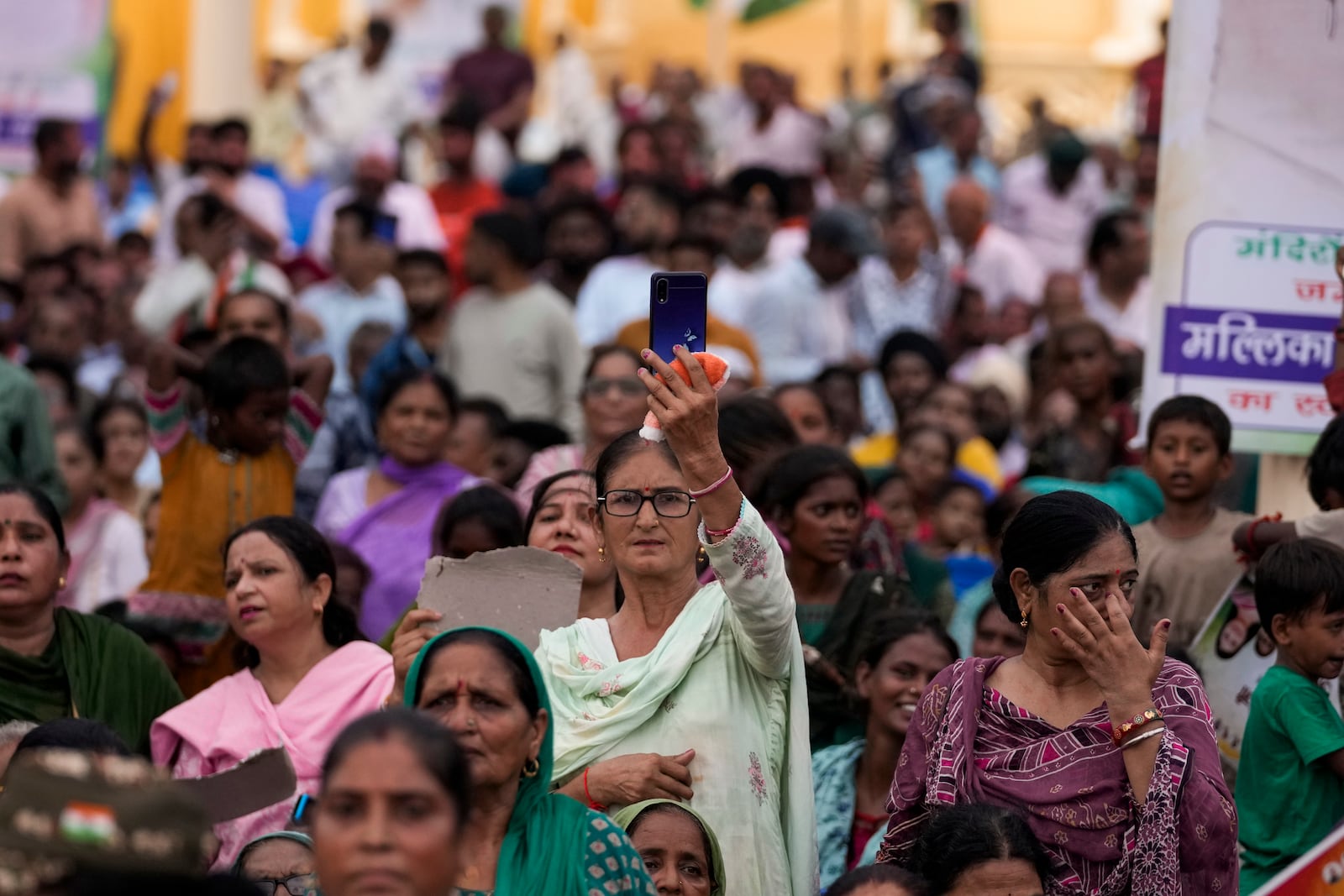 Supporters of Congress party listen as their leader Rahul Gandhi speaks during a campaign rally of Jammu and Kashmir Assembly elections in Jammu, India, Wednesday, Sept.25, 2024. (AP Photo/Channi Anand)