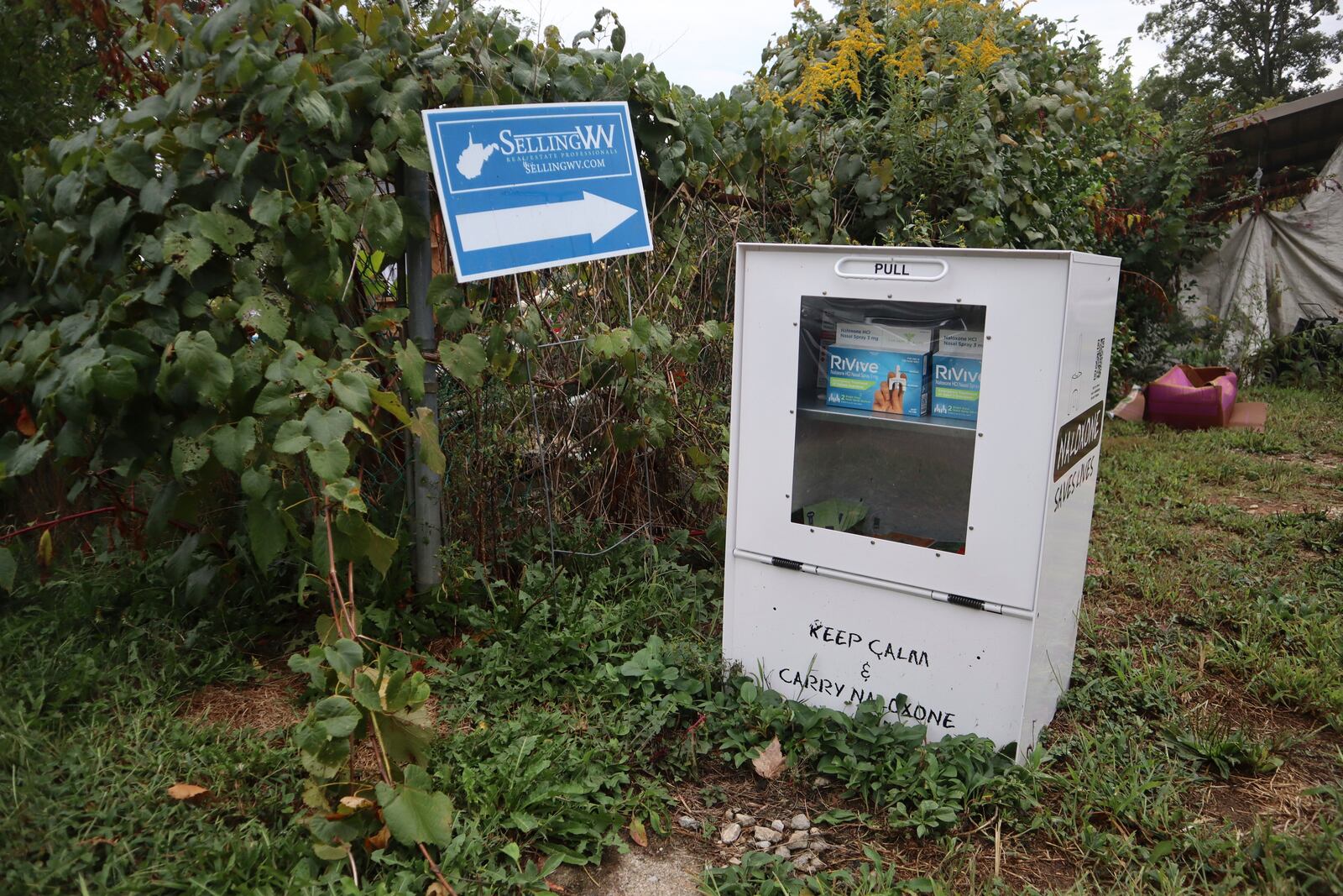 A new naloxone distribution box sits in a residential neighborhood in Hurricane, W.Va. on Tuesday, Sept. 24, 2024. (AP Photo/Leah Willingham)