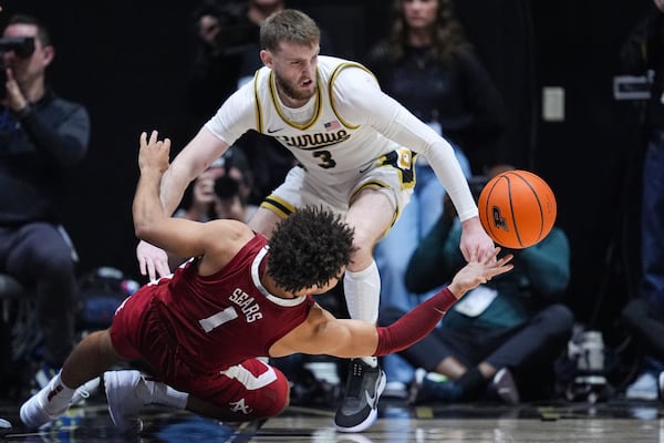 Purdue guard Braden Smith (3) steals the ball from Alabama guard Mark Sears (1) during the second half of an NCAA college basketball game in West Lafayette, Ind., Friday, Nov. 15, 2024. (AP Photo/Michael Conroy)