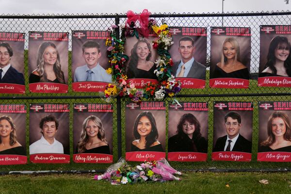 Flowers and ribbons decorate a picture of 18-year-old Rylee Britton, one of four people, including three young children, killed when a car barreled through a building used for an after-school camp, Tuesday, April 29, 2025, in Chatham, Ill. (AP Photo/Erin Hooley)