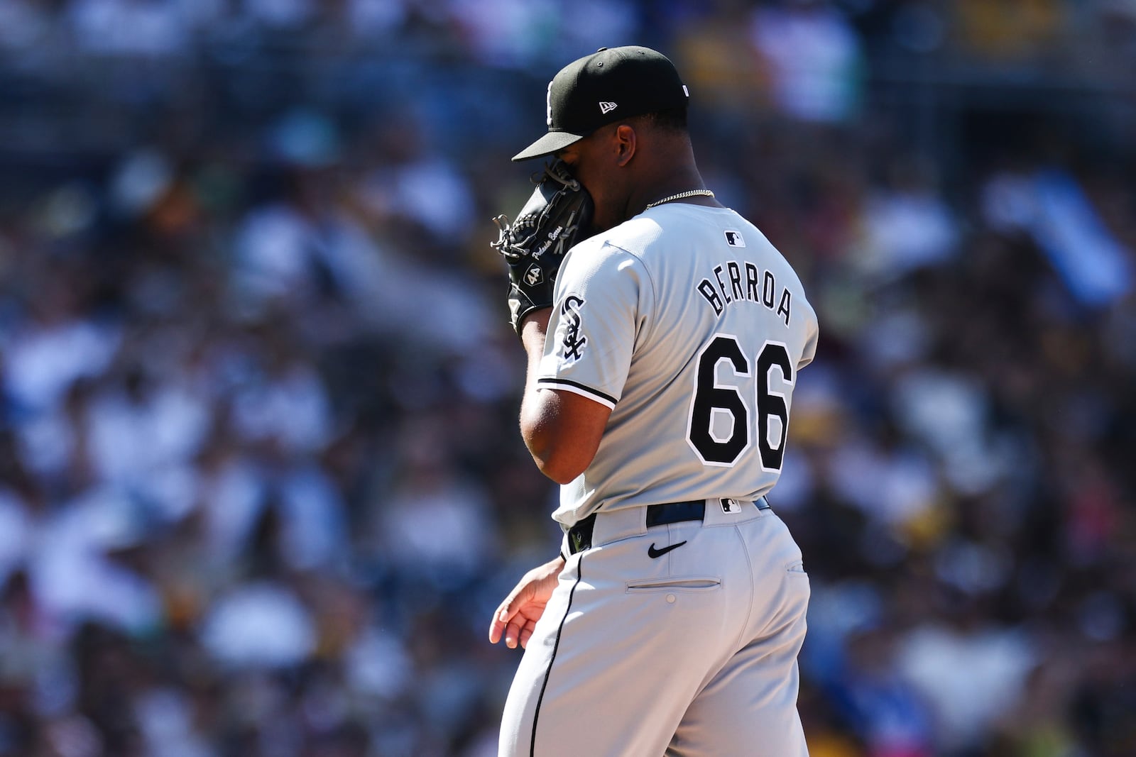 Chicago White Sox relief pitcher Prelander Berroa covers his face after being relieved in the eighth inning of a baseball game against the San Diego Padres, Sunday, Sept. 22, 2024, in San Diego. (AP Photo/Derrick Tuskan)