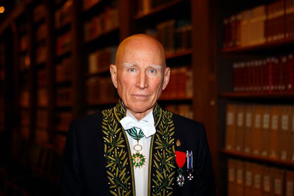FILE - Photographer Sebastiao Salgado poses for a photo after his election to the French Academy of Fine Arts during a ceremony in Paris, Dec. 6, 2017. Salgado, known for his long-term projects and images of nature and humanity, died at age 81, the Instituto Terra confirmed on Friday, May 23, 2025. (AP Photo/Francois Mori, File)