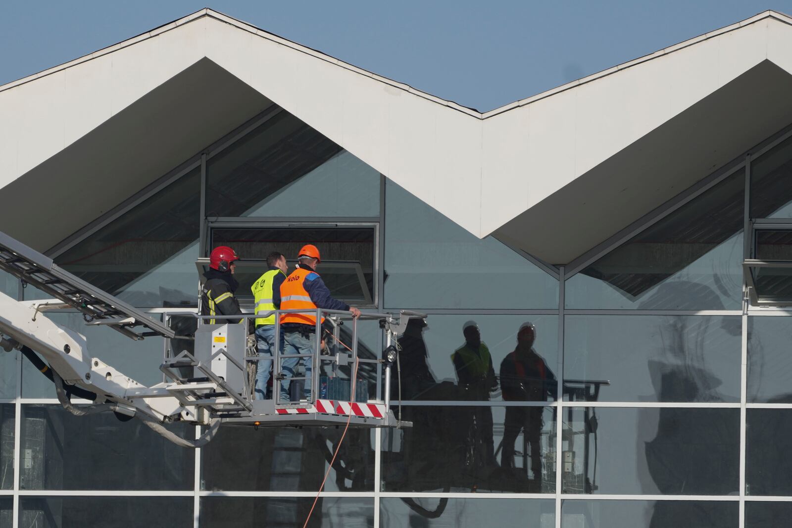 Workers inspect a train station after an outdoor roof collapsed o Friday, in Novi Sad, Serbia, Saturday, Nov. 2, 2024. (AP Photo/Darko Vojinovic)