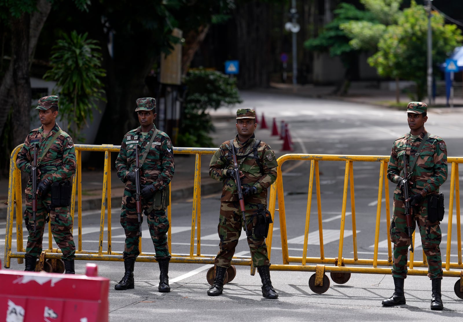 Police commandos stand guard outside a ballot counting center during presidential election in Colombo, Sri Lanka, Sunday, Sept. 22, 2024(AP Photo/Rajesh Kumar Singh)