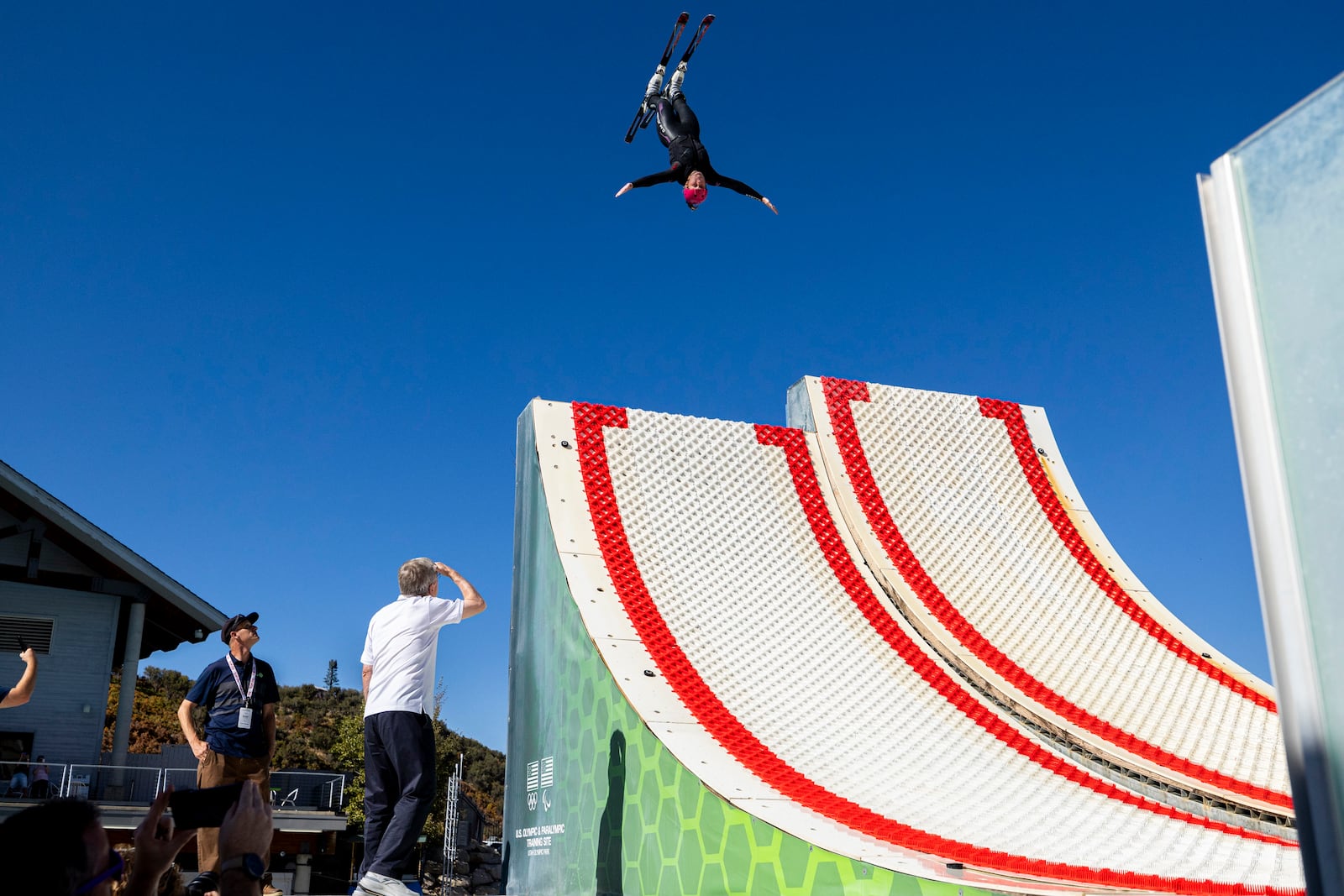 International Olympic Committee President Thomas Bach, bottom center, watches an athlete practice as he checks out the facilities at the Spence Eccles Olympic Freestyle Pool within Utah Olympic Park in Park City, Utah, Saturday, Sept. 28. 2024. (Isaac Hale/The Deseret News via AP)